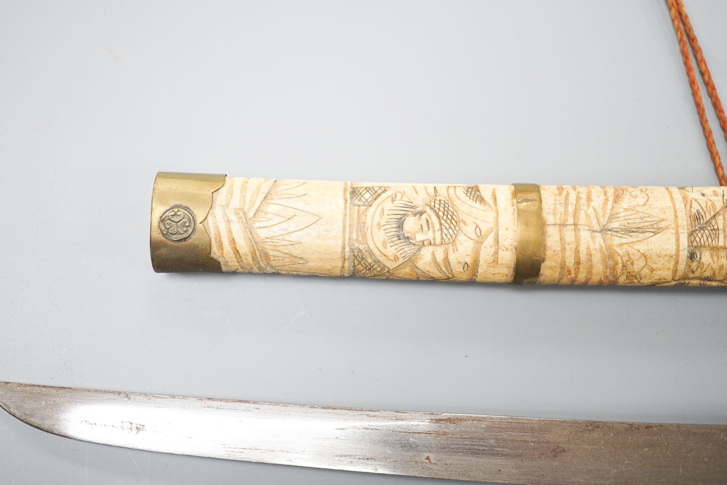 A 20th century bone and brass mounted tanto sword